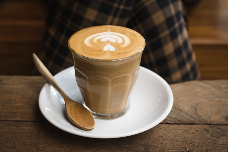 A latte with latte art on a saucer