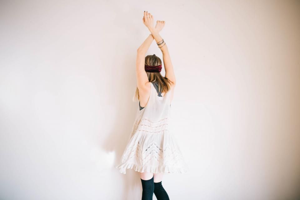A woman twirling in a white dress